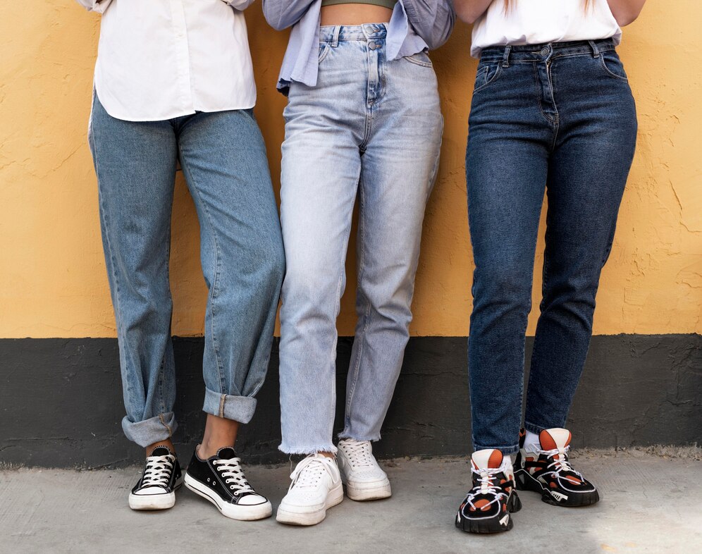 Women legs in front of a yellow wall