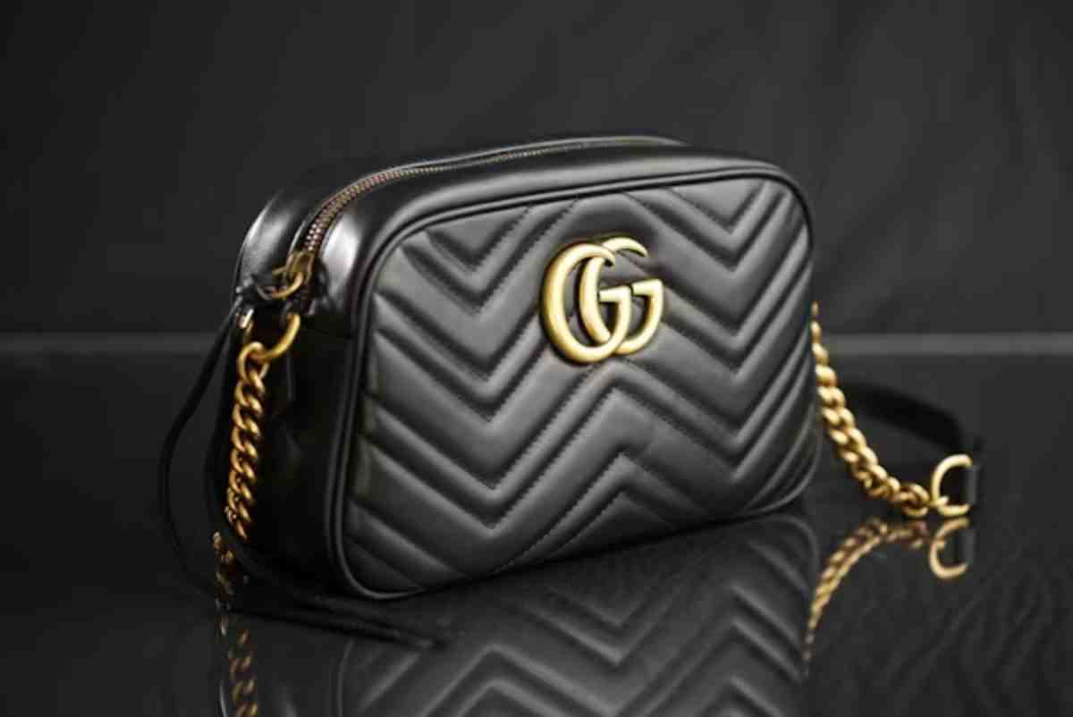 stylish black Gucci crossbody bag featuring a quilted design